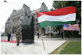 President George W. Bush and Mrs. Laura Bush stand in silence after laying flowers at the eternal flame of the 1956 Memorial Monument outside the Hungarian Parliament in Budapest, Hungary, Thursday, June 22, 2006. The monument honors victims of the 1956 Hungarian uprising against Soviet rule.