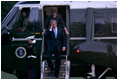 President George W. Bush and Laura Bush arrive via Marine One on the South Lawn of the White House Thursday, June 22, 2006, after a three-day European visit to Vienna and Budapest.