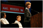 Mrs. Laura Bush flanked by Caitlyn Clarke, left, and Leslie Berger, ALA president-elect, Monday, June 26, 2006, announced that the Institute of Museum and Library Services’ Librarians for the 21st Century Program is awarding more than $20 million to support almost 3,900 library-science students at 35 universities, during the 2006 American Library Association Conference in New Orleans, Louisiana.