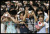 President George W. Bush and Prime Minister Junichiro Koizumi of Japan are greeted by an enthusiastic crowd of young guests during an arrival ceremony on the South Lawn Thursday, June 29, 2006.