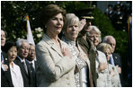 Mrs. Laura Bush stands with Lynne Pace and her husband, Chairman of the Joint Chiefs of Staff General Peter Pace, during the official arrival ceremony for Prime Minister Junichiro Koizumi of Japan on the South Lawn Thursday, June 29, 2006.