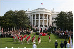 The U.S. Army Old Guard Fife and Drum Corps marches across the South Lawn during the official arrival ceremony for Prime Minister Junichiro Koizumi of Japan Thursday, June 29, 2006.