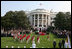 The U.S. Army Old Guard Fife and Drum Corps marches across the South Lawn during the official arrival ceremony for Prime Minister Junichiro Koizumi of Japan Thursday, June 29, 2006.