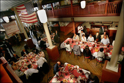 President George W. Bush, Laura Bush, and Japanese Prime Minister Junichiro Koizumi sit down for a bar-b-que lunch at Rendezvous restaurant, Friday, June 30, 2006, in Memphis, Tennessee, after taking a tour of Graceland and visiting the National Civil Rights Museum.