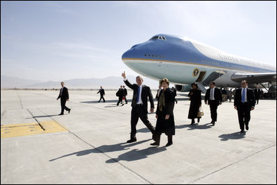 President George W. Bush gives the thumbs-up after Air Force One landed at Bagram Air Base near Kabul, Afghanistan Wednesday, March 1, 2006. The five-hour surprise visit included a meeting with Afghan President Karzai, a ceremonial ribbon-cutting at the U.S. Embassy, and a visit to the troops at Bagram.