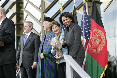 First Lady Laura Bush waves as she stands with President George W. Bush, President Hamid Karzai of Afghanistan, and Secretary of State Condoleezza Rice during welcoming ceremonies Wednesday, March 1, 2006, in Kabul.