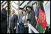 First Lady Laura Bush waves as she stands with President George W. Bush, President Hamid Karzai of Afghanistan, and Secretary of State Condoleezza Rice during welcoming ceremonies Wednesday, March 1, 2006, in Kabul.