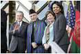 President George W. Bush waves as he stands with President Hamid Karzai of Afghanistan, Mrs. Laura Bush and Secretary of State Condoleezza Rice during welcoming ceremonies Wednesday, March 1, 2006, in Kabul.