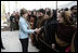 Mrs. Laura Bush greets a welcoming delegation of women, Wednesday, March 1, 2006, at the dedication of the new U.S. Embassy Building in Kabul, Afghanistan.