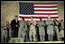 President George W. Bush meets and thanks a group of U.S. and Coalition troops, Wednesday, March 1, 2006, during a visit to Bagram Air Base in Afghanistan, where President Bush thanked the troops for their service in defense of freedom.