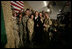 President George W. Bush poses for photos with U.S. and Coalition troops Wednesday, March 1, 2006, during a stopover at Bagram Air Base in Afghanistan, prior to his visit to India and Pakistan.