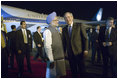 President George W. Bush is welcomed to India by Indian Prime Minister Manmohan Singh upon Air Force One's arrival Wednesday, March 1, 2006, at Indira Gandhi International Airport. The President and First Lady are scheduled to spend three days in the country before flying to Pakistan.