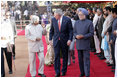 President George W. Bush listens to India's President A.P.J. Abdul Kalam as they walk the red carpet with Prime Minister Manmohan Singh during the arrival ceremony in New Delhi Thursday, March 2, 2006, welcoming the President and Mrs. Bush to India.