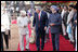 President George W. Bush listens to India's President A.P.J. Abdul Kalam as they walk the red carpet with Prime Minister Manmohan Singh during the arrival ceremony in New Delhi Thursday, March 2, 2006, welcoming the President and Mrs. Bush to India.