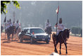 With mounted escorted, a limousine carrying the President and Mrs. Bush, head to Rashtrapati Bhavan, the official residence of the President of India in New Delhi, Thursday, March 2, 2006.