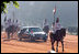 With mounted escorted, a limousine carrying the President and Mrs. Bush, head to Rashtrapati Bhavan, the official residence of the President of India in New Delhi, Thursday, March 2, 2006.