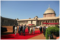 President George W. Bush and Laura Bush arrive at Rashtrapati Bhavan in New Delhi Thursday, March 2, 2006, and are escorted to welcome ceremonies by India's President A.P.J. Abdul Kalam and Prime Minister Manmohan Singh and his wife, Gusharan Kaur.