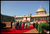 President George W. Bush and Laura Bush arrive at Rashtrapati Bhavan in New Delhi Thursday, March 2, 2006, and are escorted to welcome ceremonies by India's President A.P.J. Abdul Kalam and Prime Minister Manmohan Singh and his wife, Gusharan Kaur.