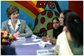 Mrs. Laura Bush listens to a question during an informal group discussion with teachers and students on her tour of Prayas, Thursday, March 2, 2006, in New Delhi, India.