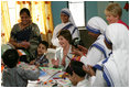 Mrs. Laura Bush meets with teachers and children, Thursday, March 2, 2006, during her visit to Mother Teresa's Jeevan Jyoti (Light of Life) Home for Disabled Children in New Delhi, India.