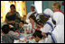 Mrs. Laura Bush meets with teachers and children, Thursday, March 2, 2006, during her visit to Mother Teresa's Jeevan Jyoti (Light of Life) Home for Disabled Children in New Delhi, India.