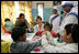 Mrs. Laura Bush meets with teachers and children, Thursday, March 2, 2006, during her visit to Mother Teresa's Jeevan Jyoti (Light of Life) Home for Disabled Children in New Delhi, India.