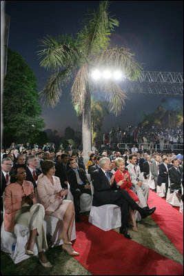 Laura Bush sits with Secretary of State Condoleezza Rice as they listen to President Bush's remarks Friday evening, March 3, 2006, in New Delhi.