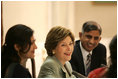 Mrs. Laura Bush addresses a roundtable discussion during an Education Through Partnerships meeting with representatives from USAID, UNESCO & CRI at library at the U.S. Embassy , Saturday, March 4, 2006 in Islamabad, Pakistan.