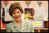 Mrs. Laura Bush reacts to a question as she attends a class lesson in the Children's Resources International clasroom at the U.S. Embassy , Saturday, March 4, 2006 in Islamabad, Pakistan.