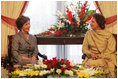 Mrs. Laura Bush speaks with Mrs. Sehba Musharraf, wife of President Pervez Musharraf, during their meeting at Aiwan-e-Sadr, Saturday, March 4, 2006 in Islamabad, Pakistan.