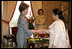 Mrs. Laura Bush greets guests during her meeting with Mrs. Sehba Musharraf, wife of President Pervez Musharraf, at Aiwan-e-Sadr, Saturday, March 4, 2006 in Islamabad, Pakistan.