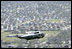 President George W. Bush in Marine One takes an aerial tour to view of the hurricane ravaged neighborhoods of New Orleans and their recovery progress, Wednesday, March 8, 2006. The President also took a walking tour in the lower 9th Ward of the city and inspected the reconstruction of a levee.