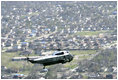 President George W. Bush in Marine One takes an aerial tour to view of the hurricane ravaged neighborhoods of New Orleans and their recovery progress, Wednesday, March 8, 2006. The President also took a walking tour in the lower 9th Ward of the city and inspected the reconstruction of a levee.