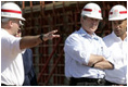 President George W. Bush and New Orleans Mayor Ray Nagin, right, view flood wall construction in the Industrial Levee Canal, Wednesday, March 8, 2006 in New Orleans, during a tour to view the clean up and reconstruction progress of New Orleans six-months after the city was devastated by Hurricane Katrina.