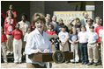 Mrs. Laura Bush addresses a crowd at the College Park Elementary School in Gautier, Miss., Wednesday, March 8, 2006, announcing the establishment of The Gulf Coast School Library Recovery Initiative, to help Gulf Coast schools that were damaged by the hurricanes rebuild their book and material collections. The initiative was established by the Laura Bush Foundation for American Libraries.