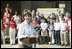 Mrs. Laura Bush addresses a crowd at the College Park Elementary School in Gautier, Miss., Wednesday, March 8, 2006, announcing the establishment of The Gulf Coast School Library Recovery Initiative, to help Gulf Coast schools that were damaged by the hurricanes rebuild their book and material collections. The initiative was established by the Laura Bush Foundation for American Libraries.