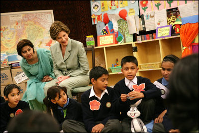 Mrs. Laura Bush listens to a student answer a question as she attends a class lesson in the Children's Resources International clasroom at the U.S. Embassy , Saturday, March 4, 2006 in Islamabad, Pakistan.