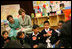 Mrs. Laura Bush listens to a student answer a question as she attends a class lesson in the Children's Resources International clasroom at the U.S. Embassy , Saturday, March 4, 2006 in Islamabad, Pakistan.