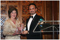 Mrs. Laura Bush is presented with an award by Kuwait Ambassador Al-Sabah, Tuesday evening, March 8, 2006 at the at "Bridges of Hope: Educating Children for a Better Future," The Kuwait-America Foundation's 2006 Benefit Dinner in Washington, in honor of her dedication to help improve the living conditions and education of children around the world.