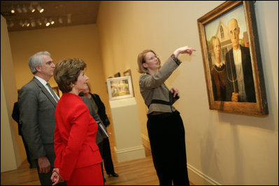 Mrs. Laura Bush listens Thursday evening, March 9, 2006 to Jane Milosch, curator of the Smithsonian American Art Museum's Renwick Gallery in Washington, as Mrs. Bush is shown the famous Grant Wood painting "American Gothic," during a tour of the Renwick Gallery exhibit, "Grant Wood's Studio: Birthplace of American Gothic," scheduled to open Friday, March 10, 2006. Mrs. Bush is accompanied on the tour by Ned. L. Rifkin, under secretary of art at the Smithsonian Institution.