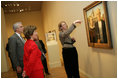 Mrs. Laura Bush listens Thursday evening, March 9, 2006 to Jane Milosch, curator of the Smithsonian American Art Museum's Renwick Gallery in Washington, as Mrs. Bush is shown the famous Grant Wood painting "American Gothic," during a tour of the Renwick Gallery exhibit, "Grant Wood's Studio: Birthplace of American Gothic," scheduled to open Friday, March 10, 2006. Mrs. Bush is accompanied on the tour by Ned. L. Rifkin, under secretary of art at the Smithsonian Institution.