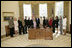 President George W. Bush and Mrs. Laura Bush meet Friday, March 10, 2006 in the Oval Office of the White House, with representatives from various organizations honored for their support the U.S. military.