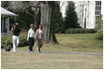 Mrs. Laura Bush takes a brisk walk with Barbara Harrison of WRC-TV (NBC 4) around the South Grounds of the White House Friday, March 10, 2006, during an interview given by Mrs. Harrison. The focus of the interview is to promote exercise and health awareness.