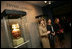 Mrs. Laura Bush, accompanied by Mrs. Marta Sahagun de Fox and Mrs. Eliane Karp de Toledo, talks with reporters following her tour of the Divine and Human: Women in Mexico and Peru Exhibit, Tuesday, March 14, 2006 at The National Museum of Women in the Arts in Washington.