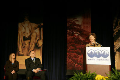 Mrs. Laura Bush addresses an audience Tuesday, March 14, 2006 at the National League of Cities Conference in Washington, asking for their communities continued support of the Helping America's Youth initiative.