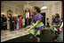 President George W. Bush and Mrs. Laura Bush join Liberia's President Ellen Johnson Sirleaf in viewing a dance performance by Moving in the Spirit, on the State Floor of the White House, Tuesday, March 21, 2006, prior to a social luncheon in honor of President Sirleaf.