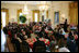 President George W. Bush and Mrs. Laura Bush join invited guests in listening to vocal star Denyce Graves at a White House social luncheon in honor of Liberia's President Ellen Johnson Sirleaf, Tuesday, March 21, 2006, at the White House.