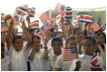 Students wave Costa Rican and American flags during Mrs. Bush's visit to their school, Escuela de los Estados Unidos, in San Jose, Costa Rica, Monday, May 8, 2006.