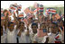 Students wave Costa Rican and American flags during Mrs. Bush's visit to their school, Escuela de los Estados Unidos, in San Jose, Costa Rica, Monday, May 8, 2006.