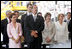 Laura Bush stands next to President Vicente Fox and his wife Marta Sahagun de Fox of Mexico during the inaugural ceremony of President Oscar Arias at the Estadio Nacional in San Jose, Costa Rica, Monday, May 8, 2006.